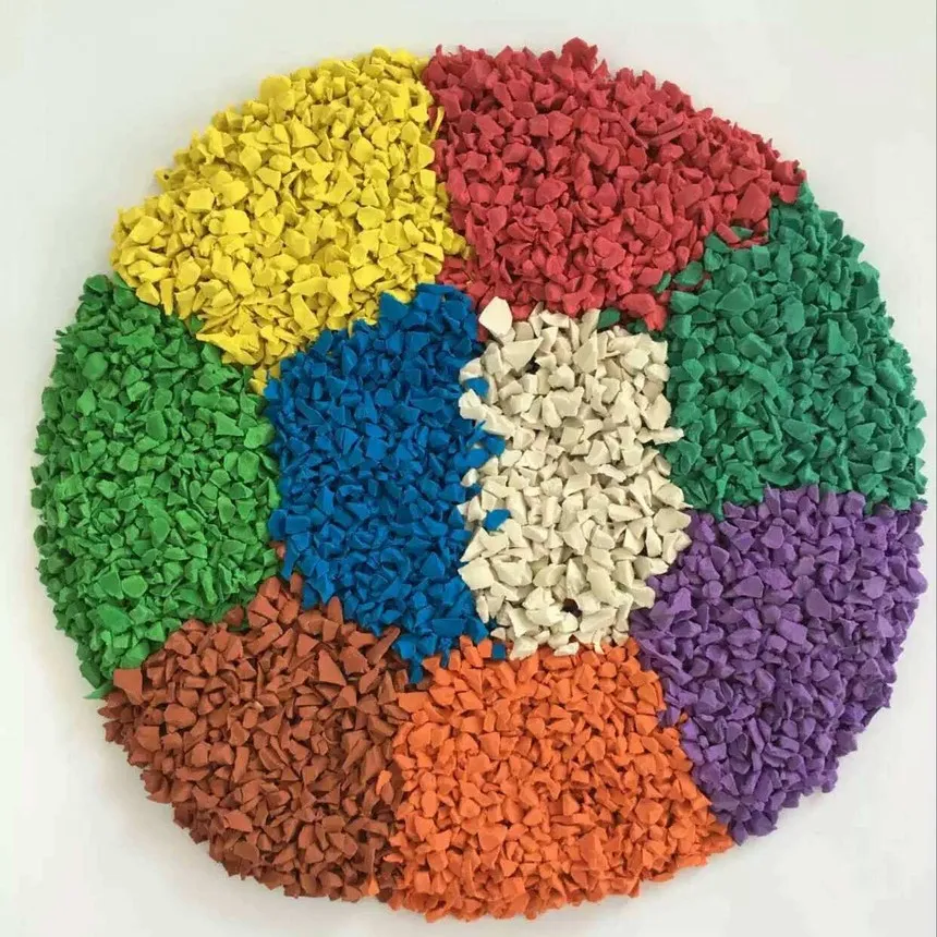 Colorful EPDM rubber granules arranged in a circular pattern, showing various bright colors like red, green, blue, and yellow.