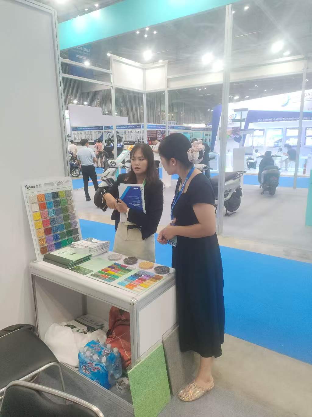 Baoli Technology team discussing sports surface solutions with customers in Vietnam