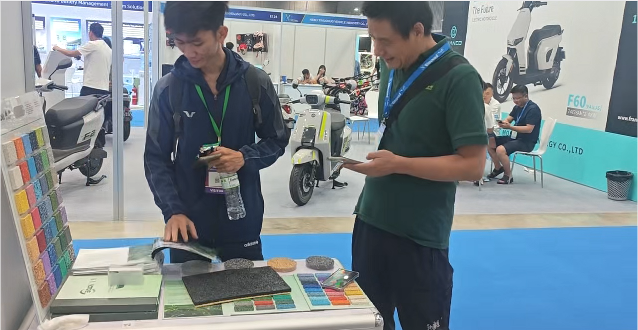 Baoli Technology team discussing sports surface solutions with customers in Vietnam