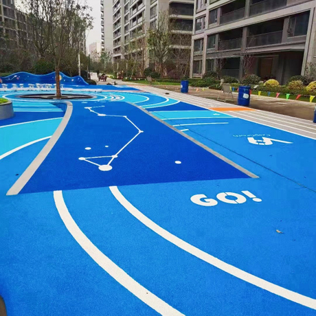 A vibrant blue EPDM granule playground surface featuring white curved lane lines, constellation patterns, and the word “GO!” — designed for children’s recreational and motor skill development.jpg